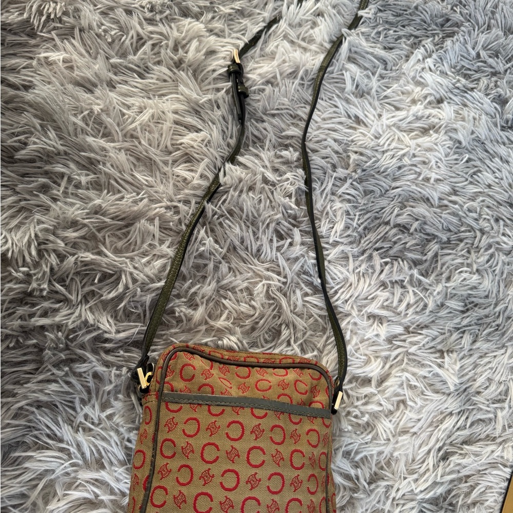 Vintage Celine Canvas Bag features a stylish red C logo and leather trim.